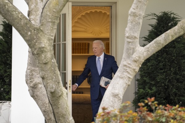 President Joe Biden walks out of the Oval Office to board Marine One on the South Lawn of the White House in Washington, Friday, March 22, 2024, to travel to Wilmington, Del. (AP Photo/Andrew Harnik)