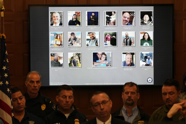 Victims of a mass shooting in this week's mass shootings, are displayed as Maine Commissioner of Public Safety Mike Sauschuck speaks during a news conference in Lewiston, Maine, Saturday, Oct. 28, 2023. Shooting suspect Robert Card, a firearms instructor who grew up in the area, was found dead Friday, in nearby Lisbon Falls. (AP Photo/Matt Rourke)