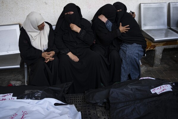 Palestinians mourn relatives killed in the Israeli bombardment of the Gaza Strip at a hospital in Rafah, Friday, Feb. 9, 2024. (APPhoto/Fatima Shbair)