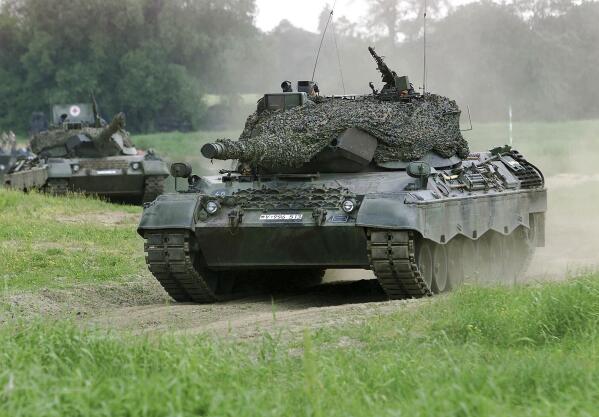 FILE - A Leopard 1 tank drives in Storkau, Germany, on May 19, 2000. Ukraine may be able to add old Leopard 1 battle tanks from German defense industry stocks to deliveries of modern tanks that Germany and other governments pledged last week. German government spokesman Steffen Hebestreit confirmed Friday that “export authorization has been granted”. (AP Photo/Eckehard Schulz, File)