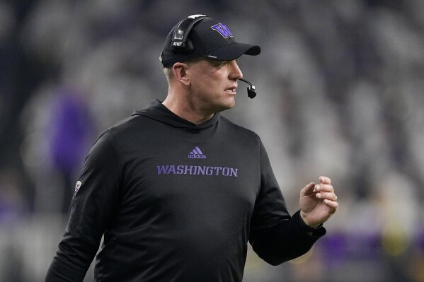 Washington head coach Kalen DeBoer watches during the first half of the national championship NCAA College Football Playoff game against Michigan Monday, Jan. 8, 2024, in Houston. (AP Photo/Eric Gay)
