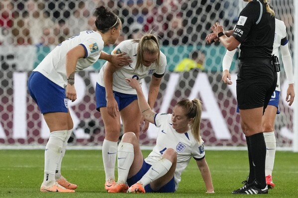 England's Keira Walsh center sits on the pitch after an injury during the Women's World Cup Group D soccer match between England and Denmark at the Sydney Football Stadium in Sydney, Australia, Friday, July 28, 2023. (AP Photo/Mark Baker)