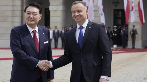 Poland's President Andrzej Duda, right, welcomes South Korean President Yoon Suk Yeol, left, for a two-day visit in Warsaw, Poland, Thursday, July 13, 2023. Yoon visits Poland after he attended a NATO summit in neighbouring Lithuania, where he sought to deepen ties with the military alliance amid global and regional security challenges. (AP Photo/Czarek Sokolowski)