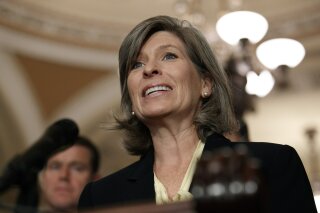 FILE - In this July 30, 2019, file photo, Sen. Joni Ernst speaks to the media with members of Senate Republican leadership after their weekly policy luncheon on Capitol Hill in Washington. An outside group founded by top political aides to Ernst has worked closely with the Iowa Republican to raise money and boost her reelection prospects, a degree of overlap that potentially violates the law, documents obtained by The Associated Press show. (AP Photo/Jacquelyn Martin, File)