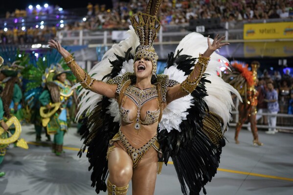 A dancer from the Colorado do Bras samba school performs during a carnival parade in Sao Paulo, Friday, Feb. 28, 2025. (AP Photo/Andre Penner)