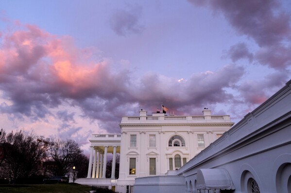 FILE - The White House is seen at sunset in Washington, Friday, Jan. 26, 2024. President Joe Biden plans to welcome Kenyan President William Ruto to the White House in May, hosting a state visit after reneging on his promise to visit Africa last year. White House press secretary Karine Jean-Pierre announced Friday that the visit set for May 23. (AP Photo/Andrew Harnik, File)