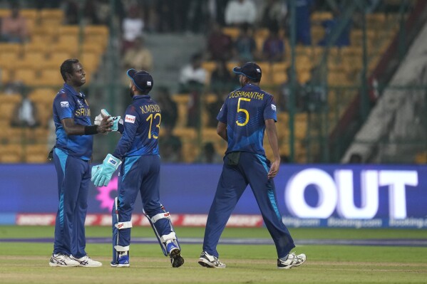 Sri Lanka's Angelo Mathews celebrates the wicket of New Zealand's Daryl Mitchell during the ICC Men's Cricket World Cup match between New Zealand and Sri Lanka in Bengaluru, India, Thursday, Nov. 9, 2023. (AP Photo/Aijaz Rahi)
