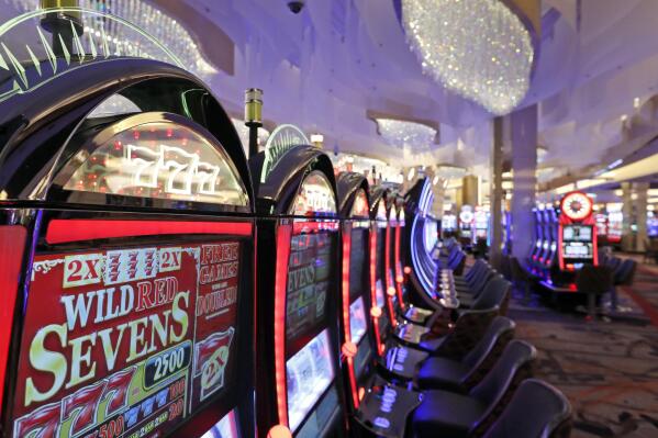 FILE - Slot machines in the casino are seen during a preview tour of the MGM National Harbor, Friday, Dec. 2, 2016 in Oxon Hill, Md. Maryland raised a record-breaking $1.5 billion for the state from gambling revenue in the last fiscal year, the lottery announced Monday, Aug. 15, 2022. (AP Photo/Alex Brandon, File)