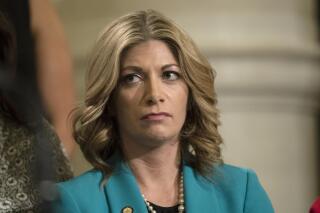 FILE - In this Wednesday, April 10, 2019 file photo, State Sen. Katie Muth, D-Montgomery, at the state Capitol in Harrisburg, Pa. State Sen. Katie Muth is suing Pennsylvania’s largest public pension system amid a federal investigation into aspects of the agency's undertakings, saying agency officials have refused to share documents with her, even though she is a board member.(AP Photo/Matt Rourke, File)