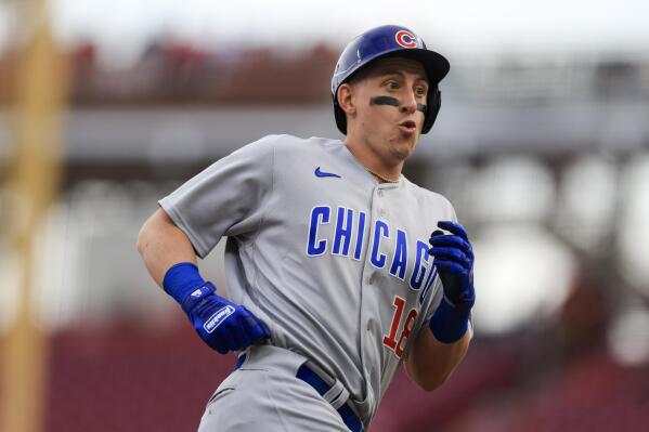 Chicago Cubs' Frank Schwindel reacts as he runs the bases after hitting a two-run home run during the first inning of a baseball game against the Cincinnati Reds in Cincinnati, Tuesday, May 24, 2022. (AP Photo/Aaron Doster)