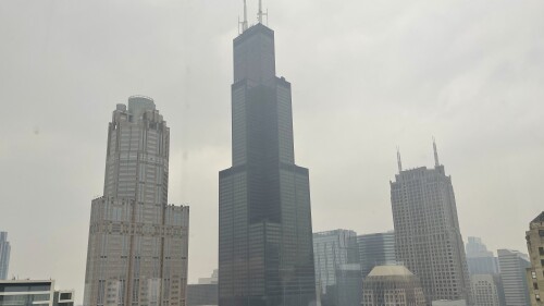 FILE - The Willis Tower (formerly Sears Tower) is pictured in downtown Chicago, where the air quality has been categorized "unhealthy" by the U.S. Environmental Protection Agency, on June 27, 2023. The EPA says extensive swaths of the northern United States awoke to unhealthy air quality Monday, July 17, or were experiencing it by midafternoon. Fine particle pollution caused by smoke from Canada’s wildfires is causing a red zone air quality index, meaning it is unhealthy for everyone. (AP Photo/Claire Savage, file)