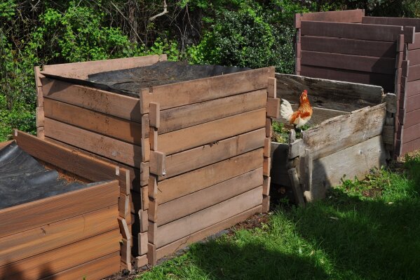 
              This undated photo shows compost bins in New Paltz, N.Y. A good compost bin makes easy work of adding ingredients or removing compost and also fends off scavengesr and retains heat and moisture. (Lee Reich via AP)
            