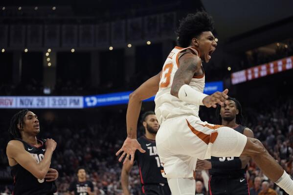 Texas forward Dillon Mitchell (23) celebrates his score against Gonzaga during the second half of an NCAA college basketball game, Wednesday, Nov. 16, 2022, in Austin, Texas. (AP Photo/Eric Gay)