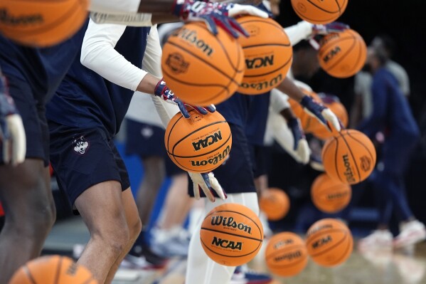 UConn players warm up during practice for their Sweet Sixteen college basketball game in the NCAA tournament, Wednesday, March 27, 2024, in Boston. (AP Photo/Michael Dwyer)