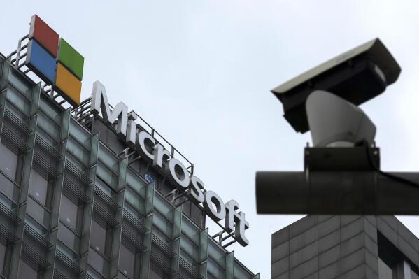 FILE - A security surveillance camera is seen near the Microsoft office building in Beijing, July 20, 2021. Coinciding with unrelenting cyberattacks against Ukraine, state-backed Russian hackers have engaged in “strategic espionage” against governments, think tanks, businesses and aid groups in 42 countries supporting Kyiv, Microsoft says in a new report.   (AP Photo/Andy Wong, File)