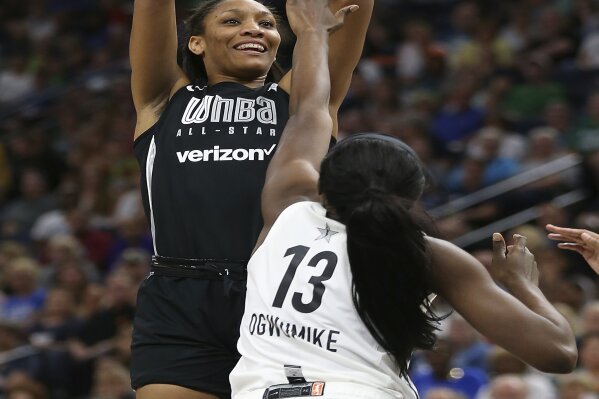 
              In this July 28, 2018, file photo, Team Delle Donne's A'ja Wilson, left, shoots the ball against the Team Candace Parker's Chiney Ogwumike, right, during the first half of the WNBA All-Star basketball game in Minneapolis. (AP Photo/Stacy Bengs, File)
            