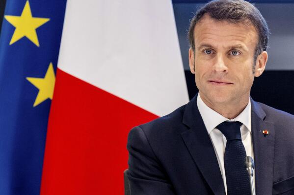 French President Emmanuel Macron visits the quantum gasses and quantum information lab of the Science faculty of the UvA, University of Amsterdam, Wednesday, April 12, 2023. (Mischa Schoemaker/Pool Photo via AP)