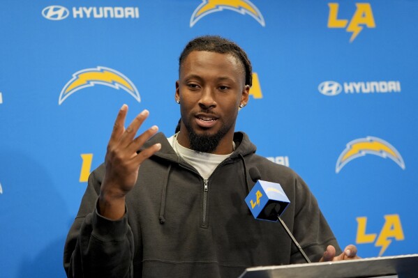 Los Angeles Chargers wide receiver Quentin Johnston speaks during a news conference after NFL football practice Tuesday, June 4, 2024, in Costa Mesa, Calif. (AP Photo/Ryan Sun)