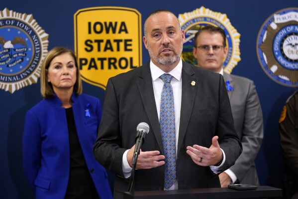FILE - Iowa Dept. of Public Safety Commissioner Stephan Bayens speaks during a news conference about the Iowa National Guard and Iowa Department of Public Safety deployment to the southern border, Wednesday, Oct. 25, 2023, in Des Moines, Iowa. Attorneys for more than two dozen Iowa and Iowa State athletes who were ensnared in a state gambling sting filed a civil lawsuit Friday, April 26, 2024, seeking unspecified monetary damages from the state and its public safety and criminal investigation agencies for violating the athletes' constitutional rights and smearing their reputations. Among the defendants are Department of Public Safety commissioner Stephan Bayens, DCI director Paul Feddersen, DCI assistant director David Jobes, DCI special agent for sports wagering Troy Nelson, and special agent Brian Sanger. (AP Photo/Charlie Neibergall, File)