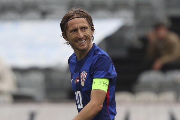 Croatia's Luka Modric celebrates after scoring his side's first goal on a penalty kick during an international friendly soccer match between Portugal and Croatia at the National Stadium in Oeiras, outside Lisbon, Saturday, June 8, 2024. (AP Photo/Pedro Rocha)