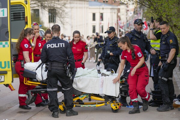 Emergency services at the scene after a person was attacked, in Oslo, Wednesday, May 1, 2024. A man carrying two knives stabbed one person and threatened around ten others in the center of Oslo, Wednesday. (Heiko Junge/NTB Scanpix via AP)