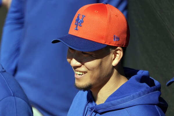 FILE - New York Mets pitcher Kodai Senga smiles during a spring training baseball workout Tuesday, Feb. 20, 2024, in Port St. Lucie, Fla. Senga is expected to begin throwing within one week after tests revealed inflammation in his right shoulder has cleared. (AP Photo/Jeff Roberson, File)