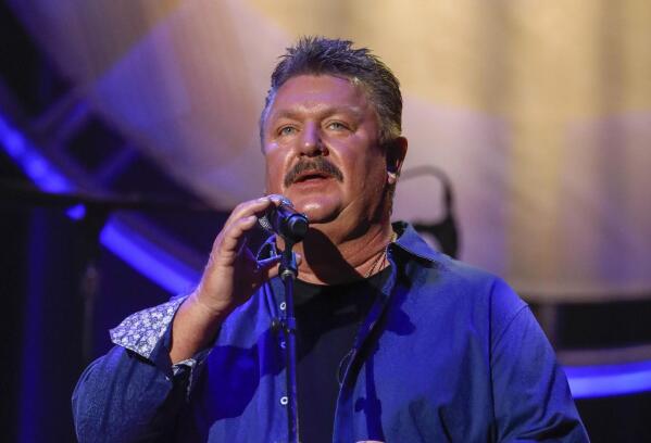 FILE - This Aug. 22, 2018 file photo shows Joe Diffie performing at the 12th annual ACM Honors in Nashville, Tenn. A publicist for Diffie says the country singer has tested positive for COVID-19. Diffie is under the care of medical professionals and is receiving treatment. (Photo by Al Wagner/Invision/AP, File)