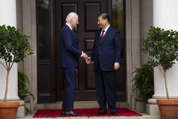 President Joe Biden greets China's President President Xi Jinping at the Filoli Estate in Woodside, Calif., Wednesday, Nov, 15, 2023, on the sidelines of the Asia-Pacific Economic Cooperative conference. (Doug Mills/The New York Times via AP, Pool)