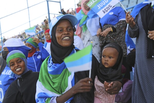 Fans watch the soccer league match between Hirshabele and Jubaland at a stadium in Mogadishu, Somalia, Tuesday, Jan 23, 2024. A stadium in the violence-prone Somali capital is hosting its first soccer tournament in three decades, drawing thousands of people to a sports facility that had fallen into disuse and later became a military base amid civil war. (AP Photo/Farah Abdi Warsameh)