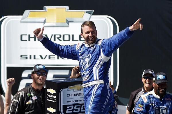 Matt DiBenedetto celebrates after winning the NASCAR Trucks series auto race Saturday, Oct. 1, 2022, in Talladega, Ala. (Photo/Butch Dill)