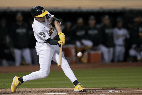 Oakland Athletics' Zack Gelof hits a two-run double against the Los Angeles Angels during the fourth inning of a baseball game Friday, Sept. 1, 2023, in Oakland, Calif. (AP Photo/Godofredo A. Vásquez)
