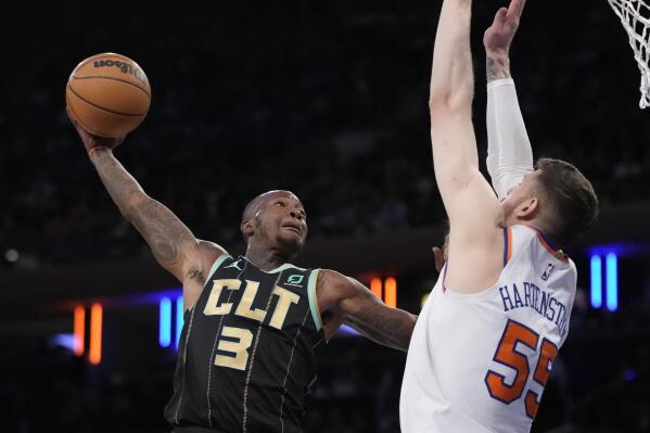 Charlotte Hornets guard Terry Rozier (3) shoots against New York Knicks center Isaiah Hartenstein (55) during the first half of an NBA basketball game, Tuesday, March 7, 2023, in New York. (AP Photo/John Minchillo)
