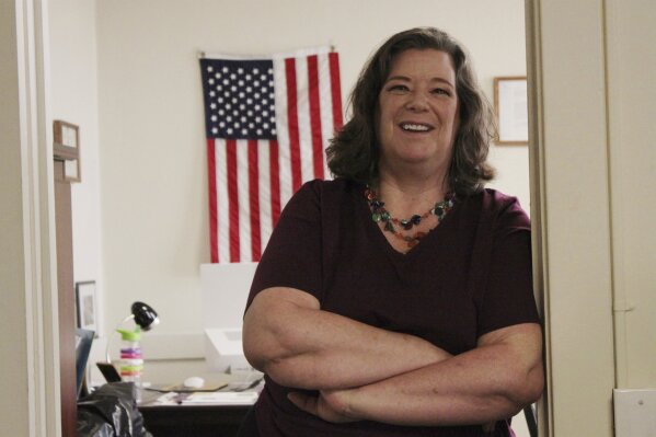 In this Aug. 9, 2019, photo, Joan Lamunyon Sanford, executive director of the New Mexico Religious Coalition for Reproductive Choice, poses for a photograph in her office in Albuquerque, N.M. The group helps an average of 100 women a year but is on track to assist 200 this year. Lamunyon Sanford said the need is growing as barriers increase and women are unable to access care where they live. (AP Photo/Susan Montoya Bryan)