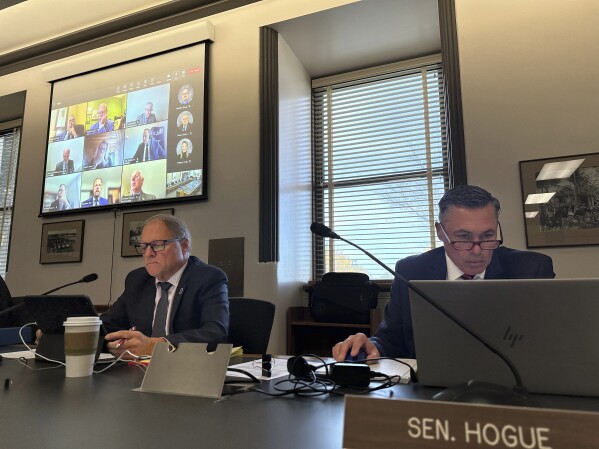 North Dakota Republican House Majority Leader Mike Lefor, at left, and Republican Senate Majority Leader David Hogue, at right, listen as Legislative Council Director John Bjornson, unseen, details a state Supreme Court ruling that struck down a major budget bill the Legislature is now rushing to address. Republican Gov. Doug Burgum on Tuesday, Oct. 17, 2023 called a special session of the Republican-controlled Legislature to address the situation. A top legislative panel was meeting Tuesday to plan for the session, including a list of bill drafts. (AP Photo/Jack Dura)