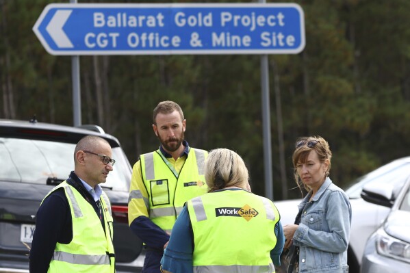 Worksafe Victoria representatives arrive for a press conference near Ballarat, Australia Thursday, March 14, 2024, after falling rocks inside a gold mine killed one worker and left another with life-threatening injuries. (Con Chronis/AAP Image via AP)