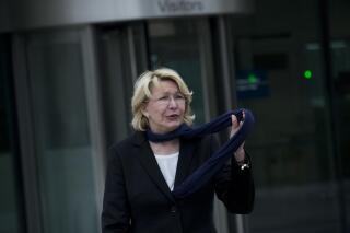 FILE - In this Nov. 16, 2017 file photo, Ousted Venezuelan prosecutor general Luisa Ortega leaves the International Criminal Court after presenting evidence denouncing President Maduro for crimes against humanity in The Hague, Netherlands. The former Venezuelan attorney general who defied President Nicolas Maduro by siding with his opponents has been implicated in a major corruption case involving a Venezuelan businessman who this week pleaded guilty to paying $1 million in bribes, two people familiar with the case said Thursday, April 22, 2021. (AP Photo/Peter Dejong, File)