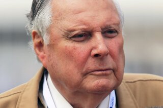 FILE- In this file photo dated July 21, 2013, BBC television presenter and commentator Peter Alliss.  Peter Alliss, who became the eccentric “Voice of Golf” on British television after a playing career in which he competed in eight Ryder Cups and was Europe’s best golfer for two seasons, has died aged 89, according to a family announcement Sunday Dec. 6, 2020. (Mike Egerton/PA file via AP)