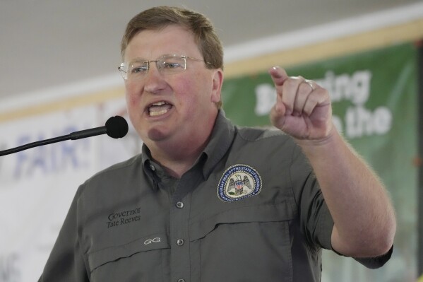 FILE - Mississippi Republican Gov. Tate Reeves addresses the crowd at the Neshoba County Fair in Philadelphia, Miss., July 27, 2023. Reeves faces two opponents in the party primary Aug. 8, as he seeks reelection. (AP Photo/Rogelio V. Solis)