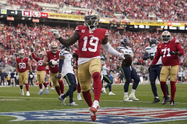 San Francisco 49ers wide receiver Deebo Samuel (19) celebrates after scoring during the second half of an NFL football game against the Seattle Seahawks in Santa Clara, Calif., Sunday, Dec. 10, 2023. (AP Photo/Godofredo A. Vásquez)