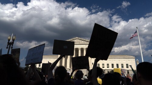 FILE - Abortion-rights activists protest outside the Supreme Court in Washington, Saturday, June 25, 2022. An Associated Press-NORC Center poll found that most U.S. adults favor allowing abortion at least in the early weeks of pregnancy. (AP Photo/Jose Luis Magana, File)