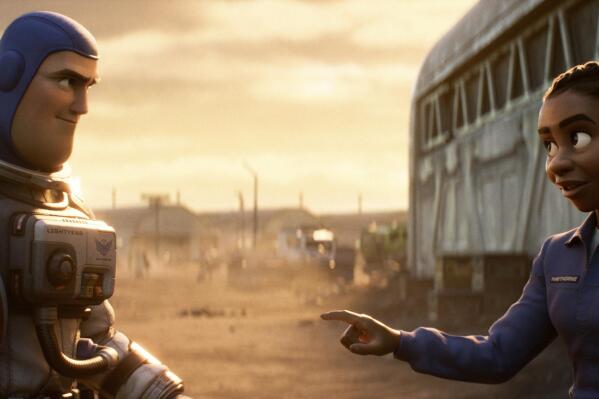 FILE - This image released by Disney/Pixar shows character Buzz Lightyear, voiced by Chris Evans, left, and Alisha Hawthorne, voiced by Uzo Aduba, in a scene from the animated film "Lightyear," releasing June 17, 2022.   Authorities across the Muslim world have barred Disney's latest animated film "Lightyear" from being played at cinemas after the inclusion of a brief kiss between a lesbian couple, the company said Thursday, June 16. (Disney/Pixar via AP, File)