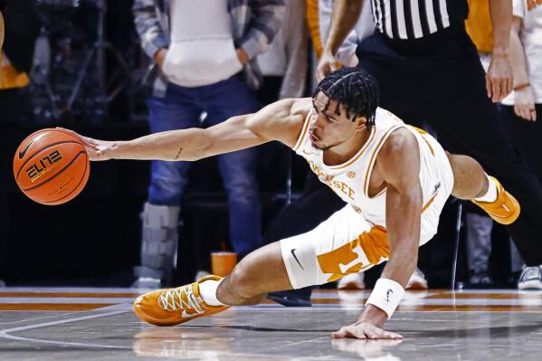 Tennessee forward Olivier Nkamhoua (13) dives for a loose ball during an NCAA college basketball game against South Carolina, Tuesday, Jan. 11, 2022, in Knoxville, Tenn. (AP Photo/Wade Payne)