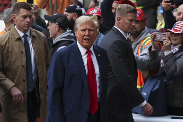 Former President Donald Trump reacts while meeting with construction workers at the construction site of the new JPMorgan Chase headquarters in midtown Manhattan, Thursday, April 25, 2024, in New York. Trump met with construction workers and union representatives hours before he's set to appear in court. (AP Photo/Yuki Iwamura)