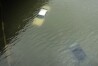 Cars are submerged on a freeway flooded in the aftermath of Hurricane Harvey near downtown Houston, Texas, on Aug. 27, 2017. (AP Photo/Charlie Riedel, File)