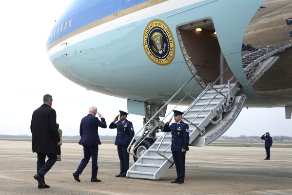 FILE - President Joe Biden, second from left, boards Air Force One, March 28, 2024, at Andrews Air Force Base, Md. Biden is headed to New York for a fundraiser. The White House and the Democratic National Committee are splitting the cost of Biden’s travel while he runs for a second term. It’s part of a longstanding arrangement that prevents taxpayers from being stuck with the full bill for political trips. (AP Photo/Alex Brandon, File)