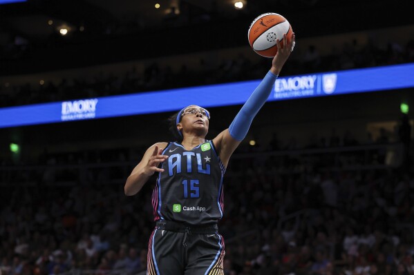 Atlanta Dream guard Allisha Gray (15) attempts a shot in the second half of an WNBA basketball game against the Indiana Fever, Thursday, May, 22, 2025, in Atlanta. (AP Photo/Colin Hubbard)