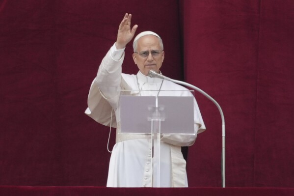 Pope Leo XIV delivers his blessing from the central balcony of St. Peter's Basilica for his first Sunday blessing after his election, in St. Peter's Square at the Vatican, Sunday, May 11, 2025.(AP Photo/Andrew Medichini)