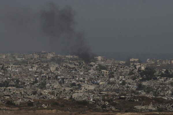 Smoke rises to the sky in the Gaza Strip as seen from southern Israel, Wednesday, April 30, 2025. (AP Photo/Ohad Zwigenberg)