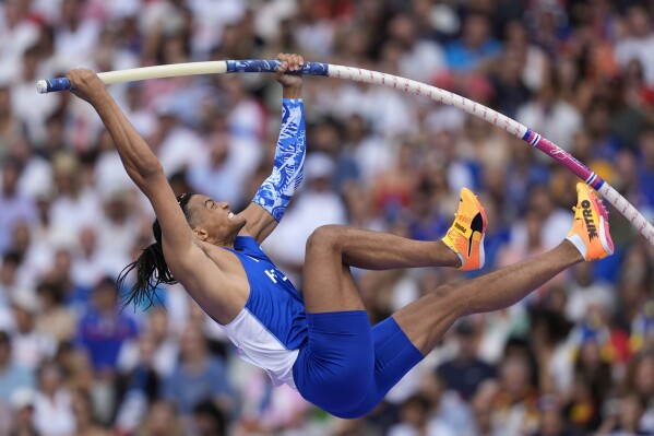 Emmanouil Karalis, of Greece, competes in the men's pole vault qualification at the 2024 Summer Olympics, Saturday, Aug. 3, 2024, in Saint-Denis, France. (AP Photo/Matthias Schrader)