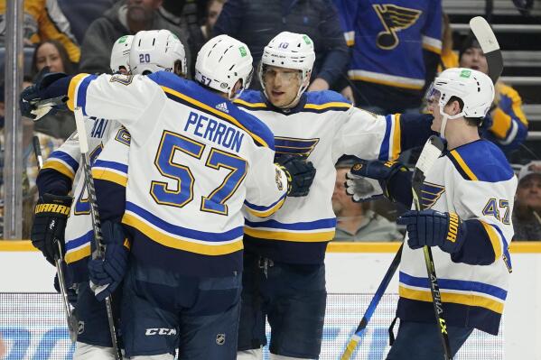 St. Louis Blues' Brayden Schenn (10) is congratulated after scoring a goal against the Nashville Predators in the first period of an NHL hockey game Sunday, April 17, 2022, in Nashville, Tenn. (AP Photo/Mark Humphrey)